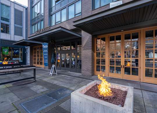 a fire pit in front of a building