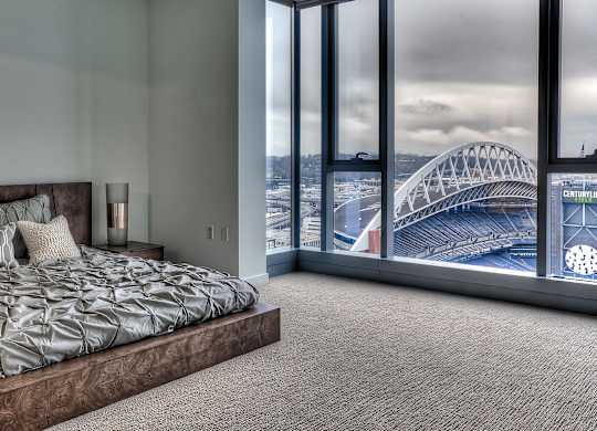 a bedroom with a view of the sydney harbour bridge