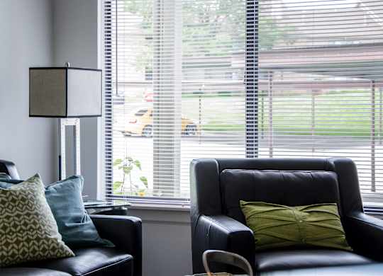 Black leather couch at Pine Ridge Apartments, Rochester Hills, MI