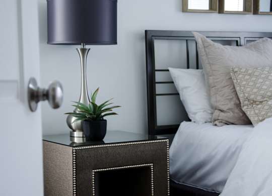 Nightstand with lamp at Pine Ridge Apartments, Michigan, 48307