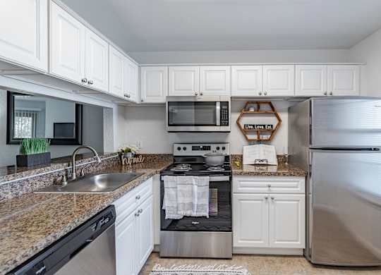 Kitchen with Cabinets at Hidden Lakes Apartments, Clarkston, Michigan