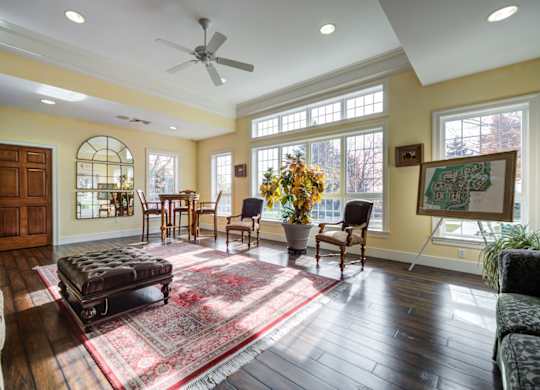 A living room with a rug and a fan at Highlands at Warwick Apartments, Lilitz, 17543