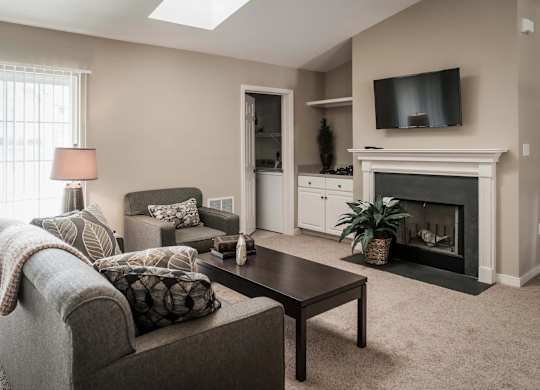 Living Room With TV And Fireplace at Highlands at Warwick Apartments, Lilitz, PA