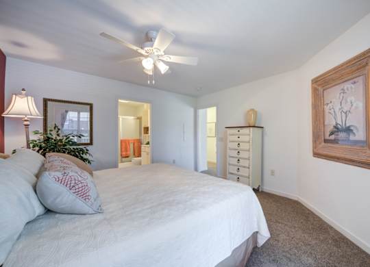 A bedroom with a bed, dresser, and a ceiling fan at The Crest at Elm Tree, Mount Joy, 17552