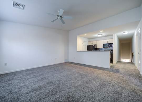 A spacious room with a ceiling fan and a carpeted floor at The Crest at Elm Tree, Pennsylvania