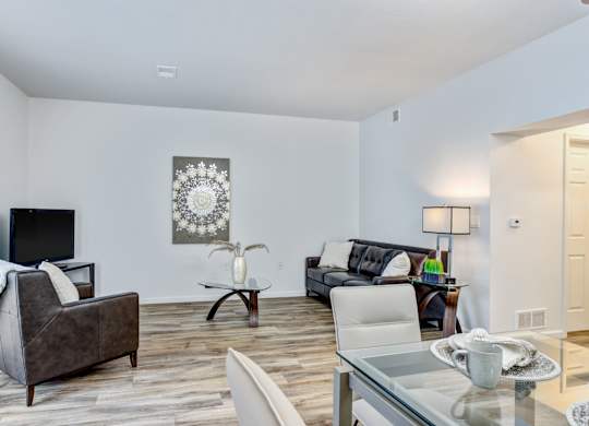 Living room with couch and tv at Woodland Meadows, Michigan, 48035