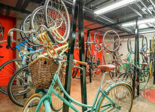 a room filled with lots of bikes on display at Garment Lofts, Los Angeles, CA 90014