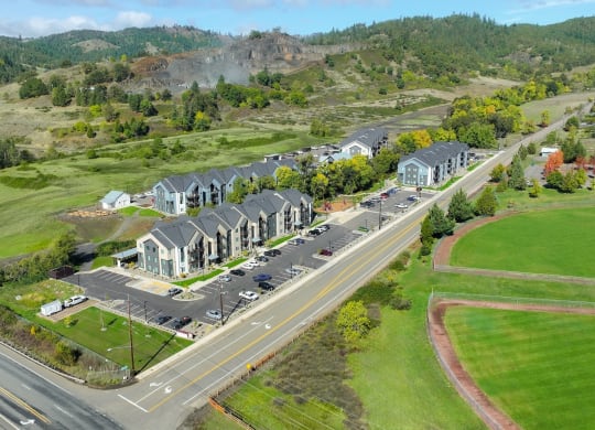 a group of houses sitting on the side of a road