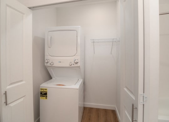 a small laundry room with a washer and dryer in it