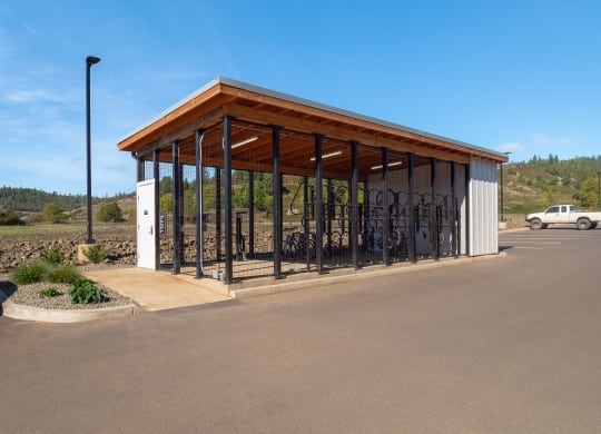 a bike rack in a parking lot next to a building