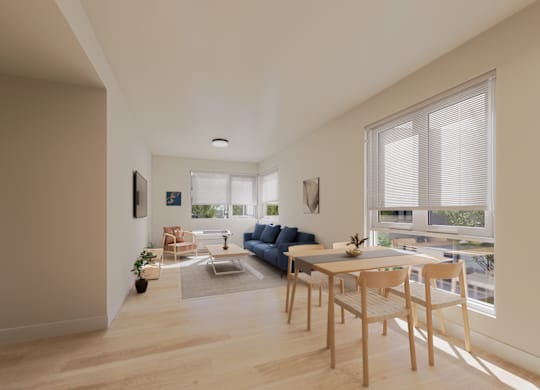 A modern living room with a blue couch and a dining table.
