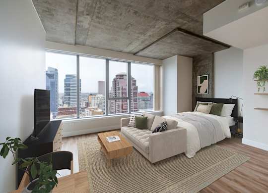 A modern bedroom with a large bed and a view of the city.