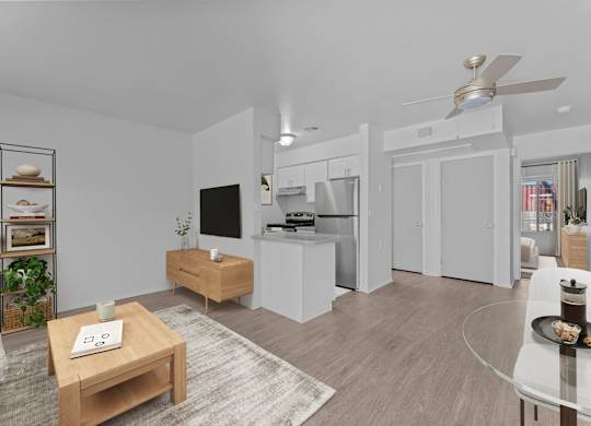 A modern living room with a white sofa, a wooden coffee table, and a ceiling fan.