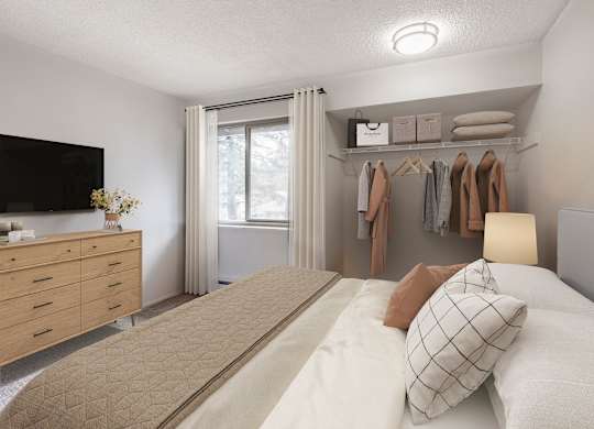 A bedroom with a bed, dresser, and a painting on the wall.