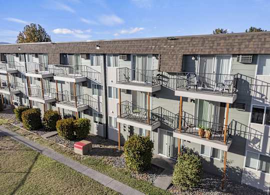 an exterior view of an apartment building with balconies