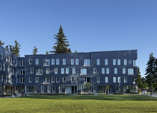 a view of the building with a grassy area in front of it