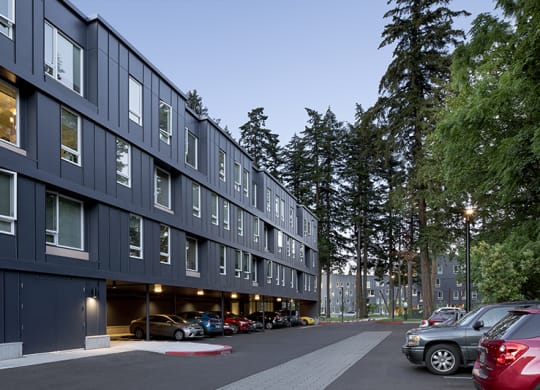 a building with a parking lot in front of it