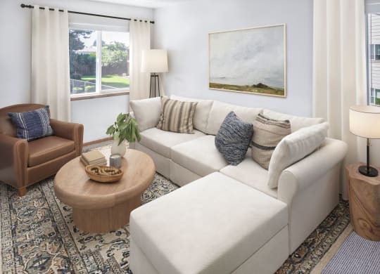 a living room filled with furniture and a large window