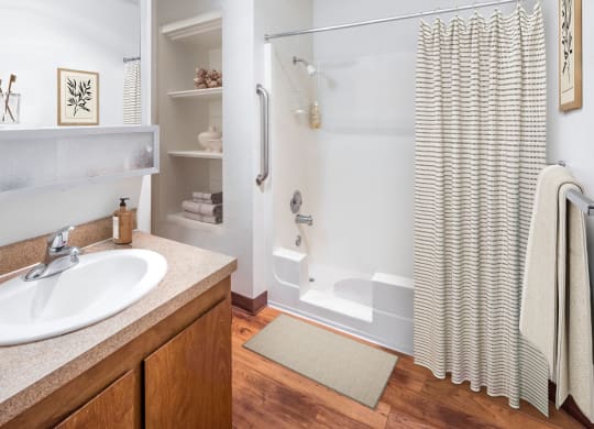 a bathroom with a shower and a sink