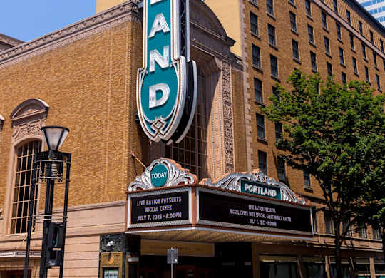 The Portland building has a blue and white sign on it.
