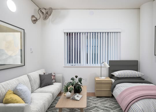 a bedroom with a bed and couch