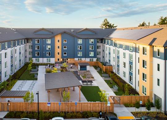 A large apartment complex with a courtyard in the middle.