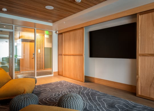 a living room with a couch and a tv at Slabtown Square Apartments, Portland , Oregon