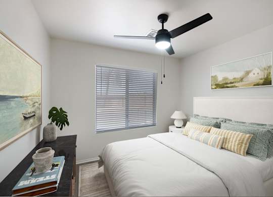 A bedroom with a bed, a ceiling fan, and a painting on the wall.