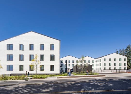 A white building with a clear blue sky in the background.