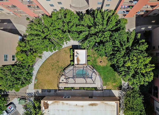 A bird's eye view of a courtyard surrounded by buildings.