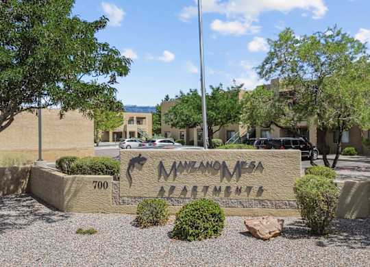 The image shows a sign for Navajo Casino in front of some buildings.