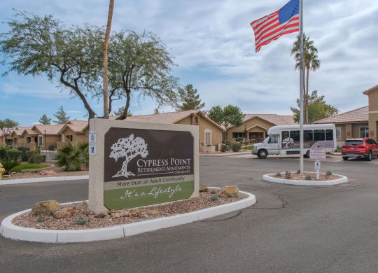 the sign at the entrance of church pointe apartments parking lot flag
