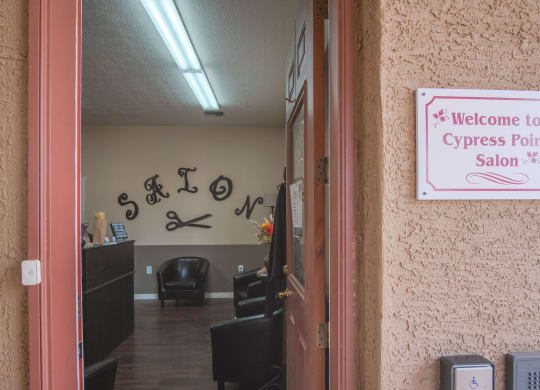 a sign that says welcome to cypress point salon