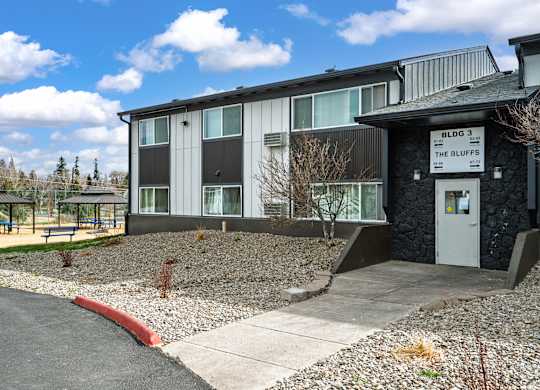 A building with a sign that says "BLVDG 3 THE BLUFFS" is shown.