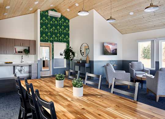A modern office space with wooden floors and furniture.