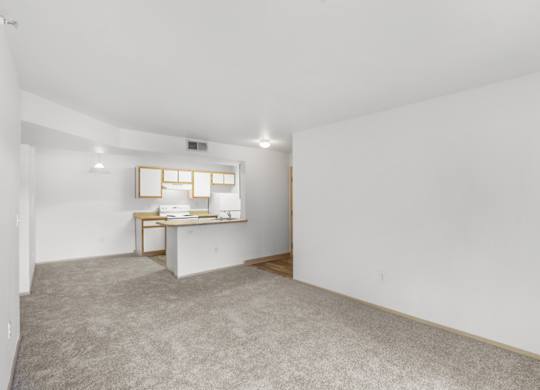 A room with a desk and a window.