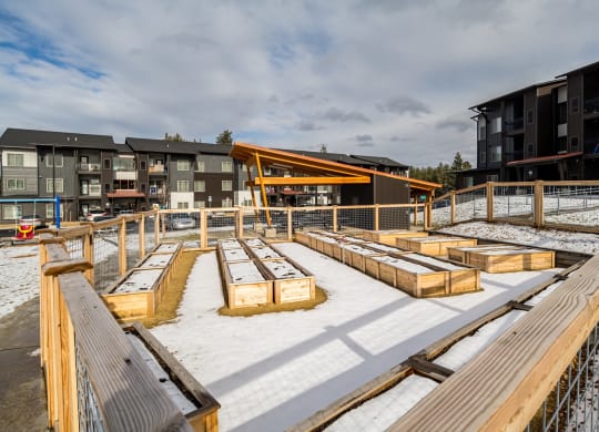 a construction site with wooden benches in the snow