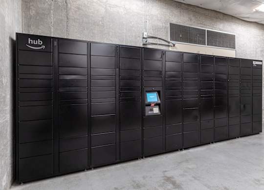 A row of black lockers with a sign that says hub on the top left.