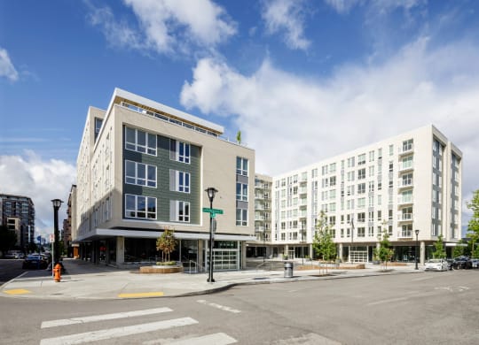 a view of an apartment buildings on the corner of a city street at Slabtown Square Apartments, Portland , Oregon