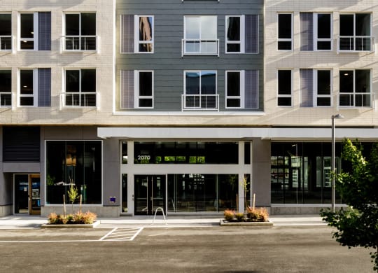 a large apartment building with a street in front of it at Slabtown Square Apartments, Oregon, 97209