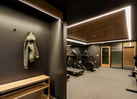 a coat hanging on a wall in a gym room at Slabtown Square Apartments, Portland , Oregon