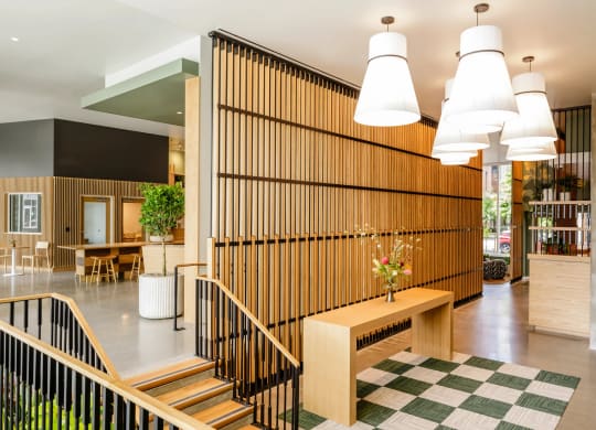 the lobby with a wooden wall and a staircase at Slabtown Square Apartments, Oregon, 97209