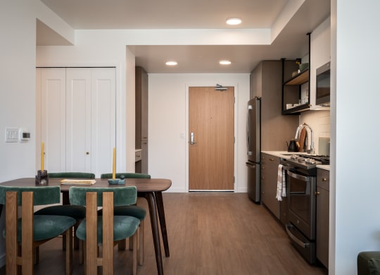 a kitchen and dining room with a table and chairs at Slabtown Square Apartments, Portland 