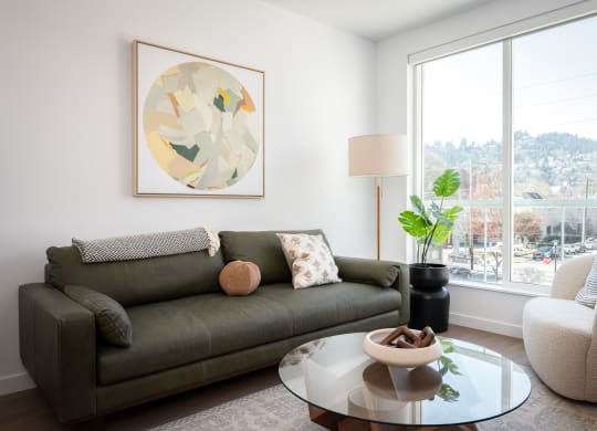 a living room with a couch and a coffee table at Slabtown Square Apartments, Oregon, 97209