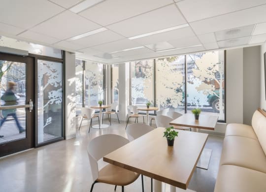 a room filled with furniture and a large window