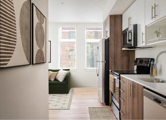 a kitchen and living room in a small apartment