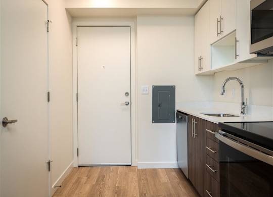 a kitchen with a sink and a door