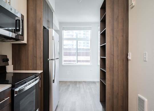 a kitchen with a large window and a