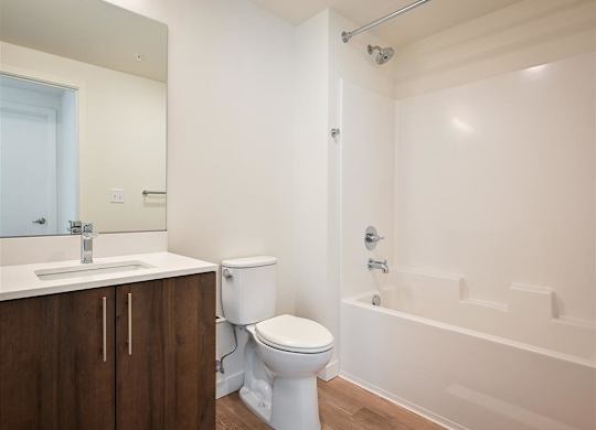a bedroom with white walls and white doors and carpet