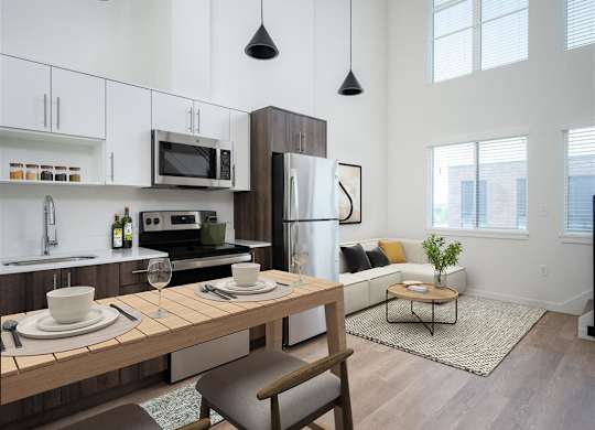 a kitchen and living room in an apartment